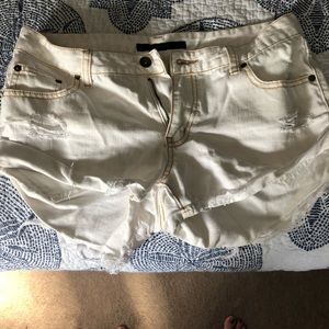 Billabong white shorts, slightly longer in back.